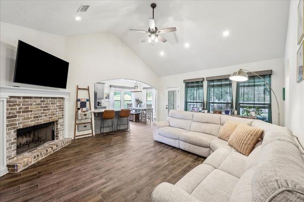 Dining room, Fireplace, Interior, Living room, Recessed Lighting, Wood Texture Flooring