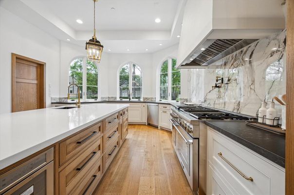 Interior, Kitchen, Marble Walls, Pendant Lights, Recessed Lighting, Stainless Steel Appliances, Wood Texture Flooring