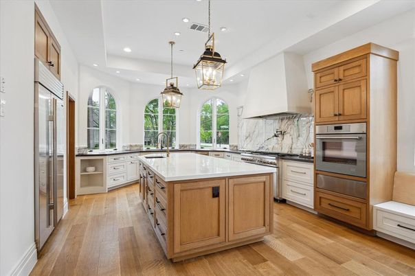 Interior, Kitchen, Marble Walls, Pendant Lights, Recessed Lighting, Stainless Steel Appliances, Wood Texture Flooring