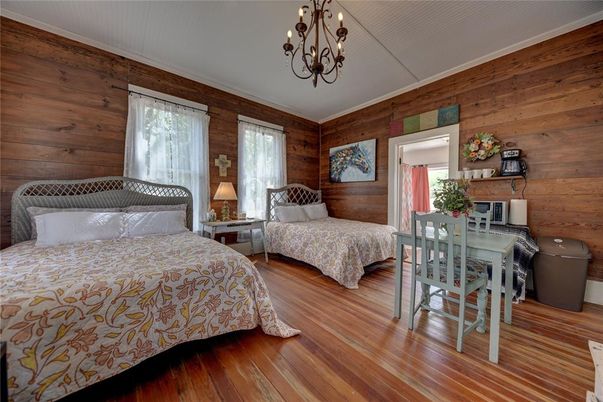 Bedroom, Chandelier, Dining room, Interior, Wood Texture Flooring, Wooden Walls