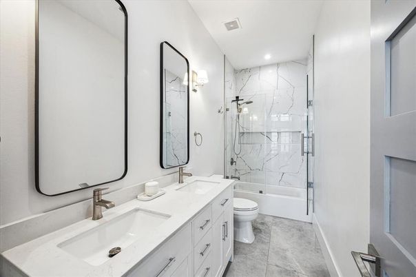 Bathroom, Dual Sink Vanities, Glass Shower, Interior, Marble Walls, Recessed Lighting