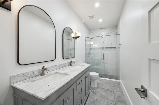 Bathroom, Dual Sink Vanities, Glass Shower, Interior, Marble Walls, Recessed Lighting