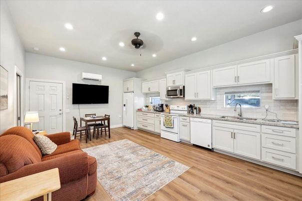 Dining room, Interior, Kitchen, Living room, Recessed Lighting, Stainless Steel Appliances, Wood Texture Flooring