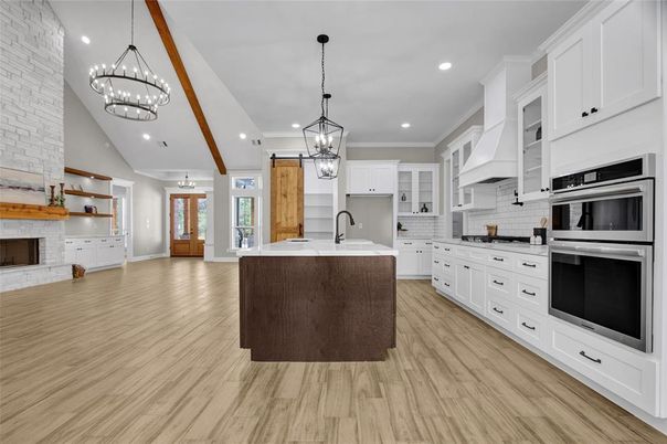 Chandelier, Fireplace, Interior, Kitchen, Pendant Lights, Recessed Lighting, Stainless Steel Appliances, Wooden Beams, Wood Texture Flooring