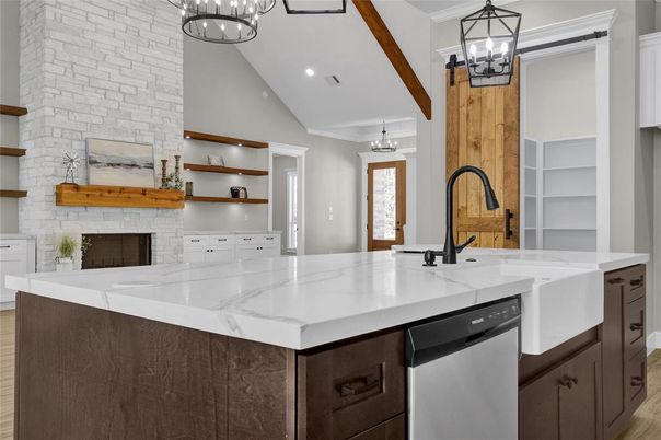 Fireplace, Interior, Kitchen, Pendant Lights, Recessed Lighting, Stainless Steel Appliances, Stone Walls, Wood Texture Flooring