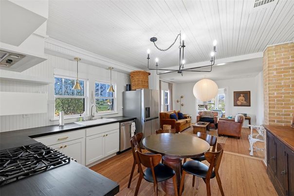 Dining room, Interior, Kitchen, Living room, Pendant Lights, Stainless Steel Appliances, Stone Walls, Wood Texture Flooring