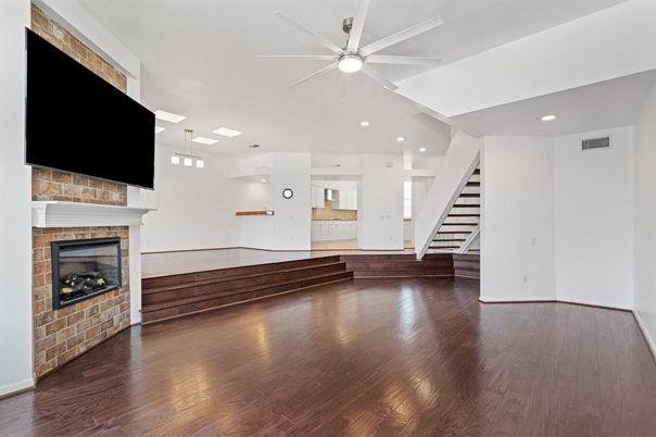 Empty room, Fireplace, Interior, Pendant Lights, Recessed Lighting, Stone Walls, Wood Texture Flooring