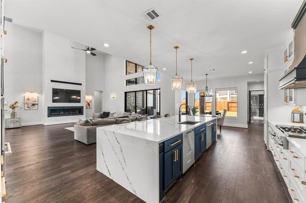 Fireplace, Interior, Kitchen, Living room, Pendant Lights, Recessed Lighting, Stainless Steel Appliances, Wood Texture Flooring