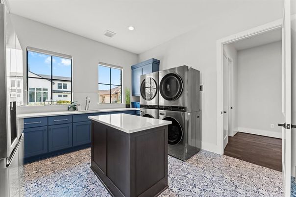 Interior, Kitchen, Recessed Lighting, Washer, Wood Texture Flooring