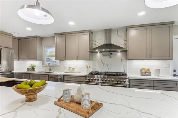 Interior, Kitchen, Marble Walls, Recessed Lighting, Stainless Steel Appliances