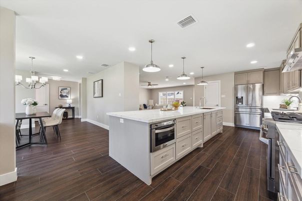 Chandelier, Dining room, Interior, Kitchen, Pendant Lights, Recessed Lighting, Stainless Steel Appliances, Wood Texture Flooring
