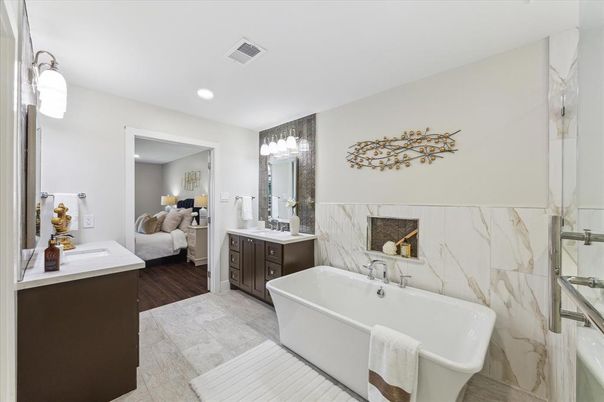 Bathroom, Bedroom, Dual Sink Vanities, Free Standing Baths, Interior, Marble Walls, Recessed Lighting, Wood Texture Flooring