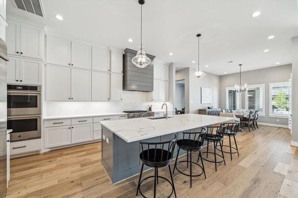 Chandelier, Dining room, Interior, Kitchen, Pendant Lights, Recessed Lighting, Stainless Steel Appliances, Wood Texture Flooring
