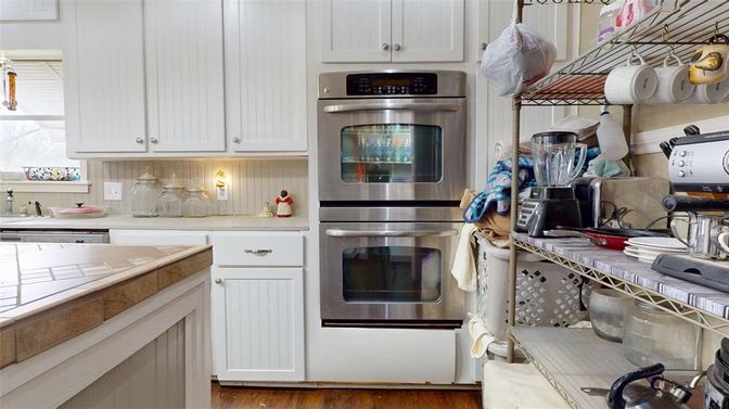 Interior, Kitchen, Stainless Steel Appliances, Tile Countertops, Wood Texture Flooring