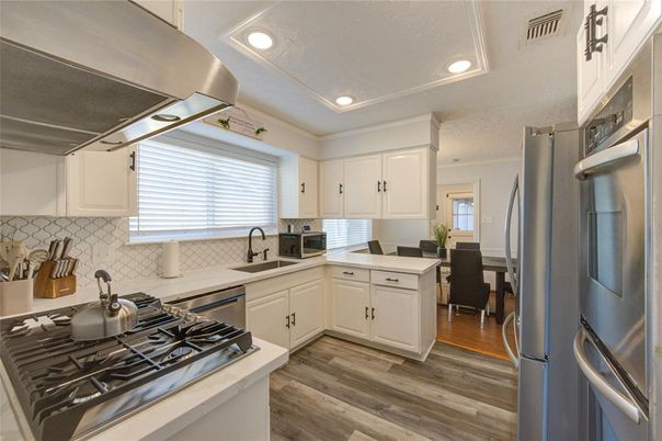 Dining room, Interior, Kitchen, Recessed Lighting, Stainless Steel Appliances, Wood Texture Flooring