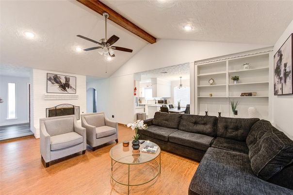 Dining room, Fireplace, Interior, Living room, Pendant Lights, Recessed Lighting, Wooden Beams, Wood Texture Flooring