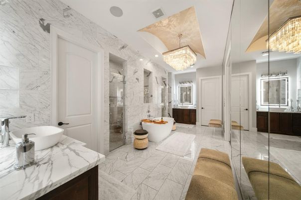 Bathroom, Chandelier, Dual Sink Vanities, Free Standing Baths, Glass Shower, Interior, Marble, Marble Walls, Recessed Lighting