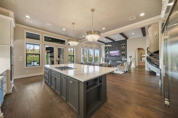 Chandelier, Dining room, Fireplace, Interior, Kitchen, Living room, Pendant Lights, Recessed Lighting, Stainless Steel Appliances, Wood Texture Flooring