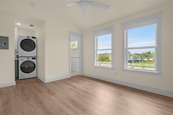 Empty room, Interior, Recessed Lighting, Utility Closets, Washer, Wood Texture Flooring