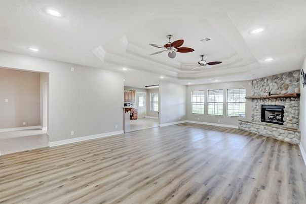 Empty room, Fireplace, Interior, Recessed Lighting, Stone Walls, Wood Texture Flooring