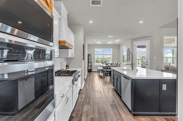 Dining room, Interior, Kitchen, Recessed Lighting, Stainless Steel Appliances, Wood Texture Flooring
