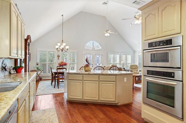 Chandelier, Dining room, Interior, Kitchen, Living room, Stainless Steel Appliances, Wood Texture Flooring
