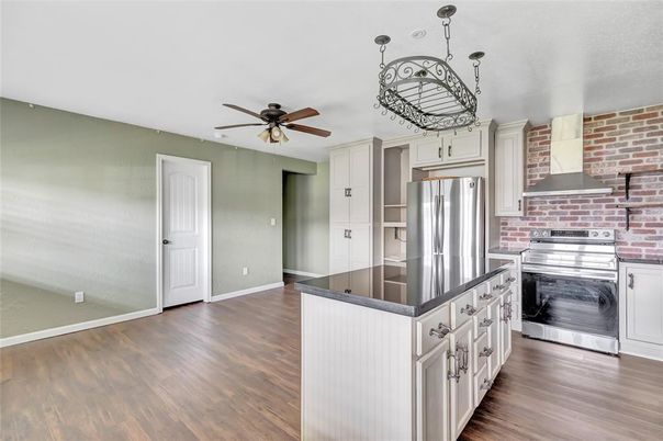 Interior, Kitchen, Pendant Lights, Stainless Steel Appliances, Stone Walls, Wood Texture Flooring
