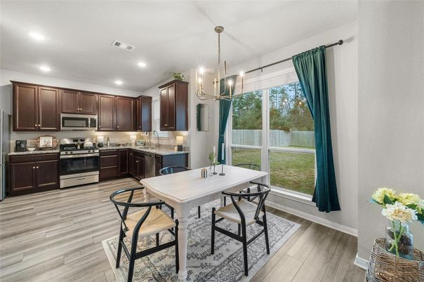 Dining room, Interior, Kitchen, Pendant Lights, Recessed Lighting, Stainless Steel Appliances, Wood Texture Flooring