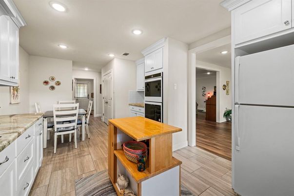 Dining room, Interior, Kitchen, Recessed Lighting, Stainless Steel Appliances, Wood Texture Flooring