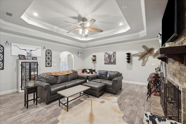 Fireplace, Interior, Living room, Recessed Lighting, Stone Walls, Wood Texture Flooring