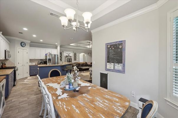 Chandelier, Dining room, Interior, Kitchen, Living room, Recessed Lighting, Stainless Steel Appliances, Wood Texture Flooring