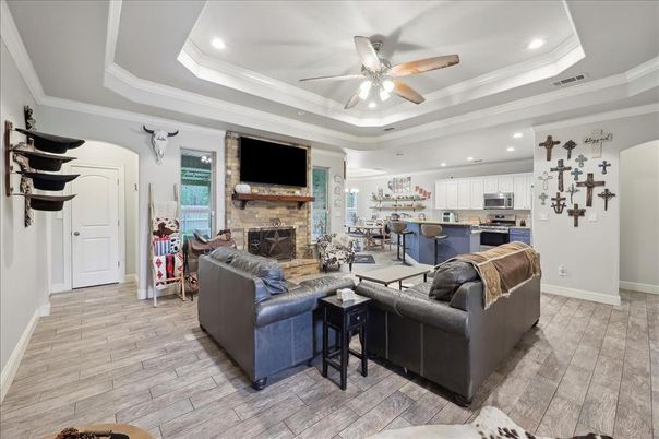 Fireplace, Interior, Kitchen, Living room, Recessed Lighting, Stainless Steel Appliances, Stone Walls, Wood Texture Flooring