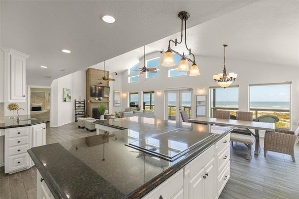 Chandelier, Dining room, Interior, Kitchen, Living room, Pendant Lights, Recessed Lighting, Water, Wood Texture Flooring