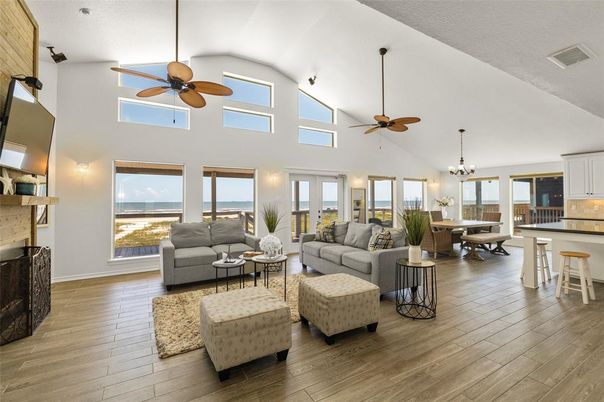 Chandelier, Dining room, Fireplace, Interior, Living room, Pendant Lights, Water, Wood Texture Flooring
