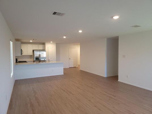 Empty room, Interior, Kitchen, Recessed Lighting, Stainless Steel Appliances, Wood Texture Flooring