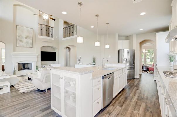Fireplace, Interior, Kitchen, Living room, Pendant Lights, Recessed Lighting, Stainless Steel Appliances, Wood Texture Flooring