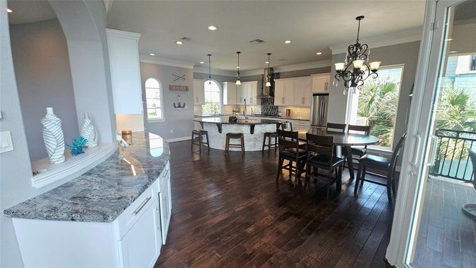 Chandelier, Dining room, Interior, Kitchen, Pendant Lights, Recessed Lighting, Stainless Steel Appliances, Wood Texture Flooring
