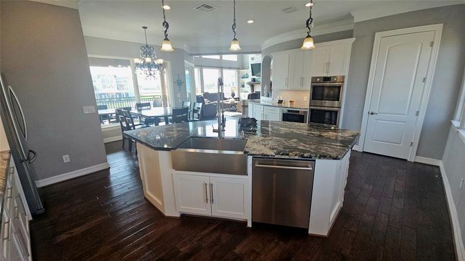 Dining room, Interior, Kitchen, Pendant Lights, Recessed Lighting, Stainless Steel Appliances, Wood Texture Flooring