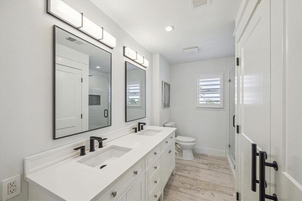 Bathroom, Dual Sink Vanities, Interior, Recessed Lighting, Wood Texture Flooring