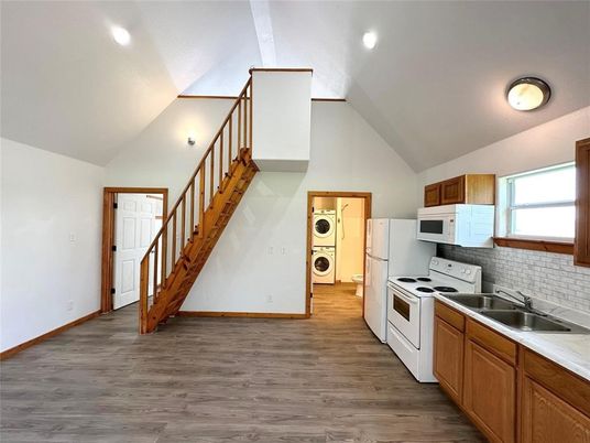 Interior, Kitchen, Recessed Lighting, Washer, Wood Texture Flooring