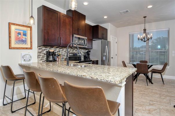 Chandelier, Dining room, Interior, Kitchen, Pendant Lights, Recessed Lighting, Stainless Steel Appliances