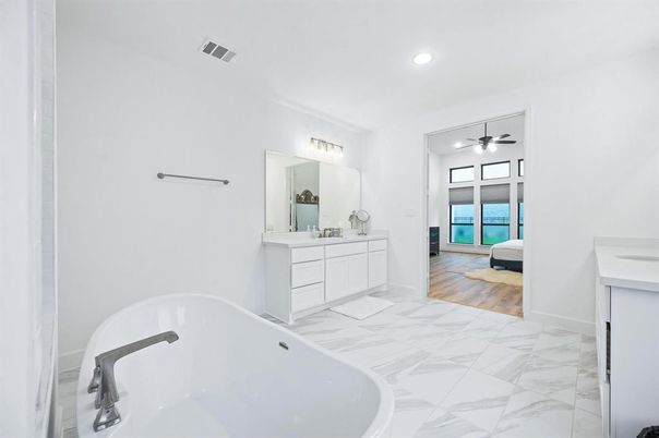 Bathroom, Dual Sink Vanities, Free Standing Baths, Interior, Marble, Recessed Lighting, Wood Texture Flooring