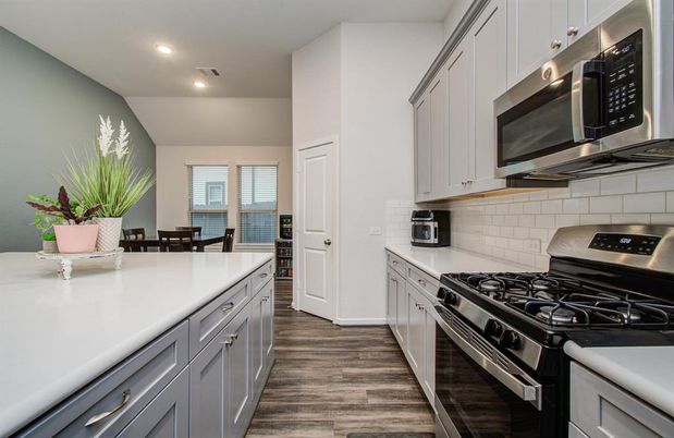 Dining room, Interior, Kitchen, Recessed Lighting, Stainless Steel Appliances, Wood Texture Flooring