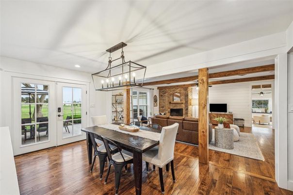 Dining room, Fireplace, Interior, Living room, Pendant Lights, Recessed Lighting, Stone Walls, Wooden Beams, Wood Texture Flooring
