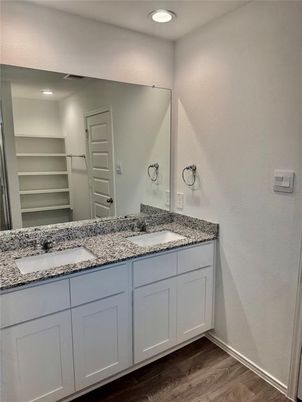 Bathroom, Dual Sink Vanities, Interior, Recessed Lighting, Walk-in Closets, Wood Texture Flooring