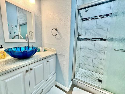 Bathroom, Glass Shower, Interior, Marble Walls, Tile Countertops