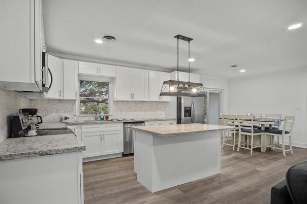 Dining room, Interior, Kitchen, Pendant Lights, Recessed Lighting, Stainless Steel Appliances, Wood Texture Flooring