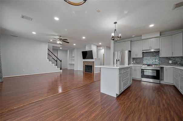 Fireplace, Interior, Kitchen, Pendant Lights, Recessed Lighting, Stainless Steel Appliances, Wood Texture Flooring