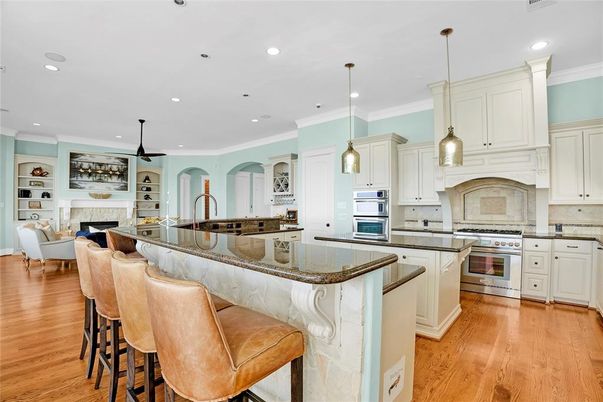 Fireplace, Interior, Kitchen, Living room, Pendant Lights, Recessed Lighting, Stainless Steel Appliances, Wood Texture Flooring