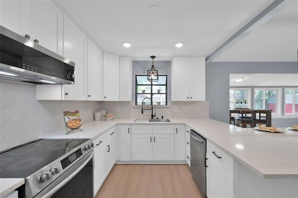 Dining room, Interior, Kitchen, Pendant Lights, Recessed Lighting, Stainless Steel Appliances, Wood Texture Flooring